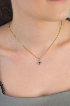Złota zawieszka 585 białe złoto tanzanit i diamenty 60027079 HSI Złota zawieszka wykonana z próby 585 z tanzanitem i 19 diamentami o wielkości 0,06 ct, barwie H i czystości SI. Piękna i elegancka biżuteria. Zawieszka wy (5).JPG